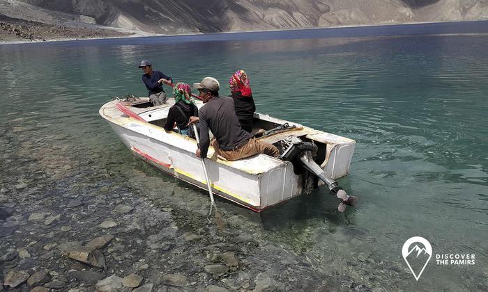 Sailing to another part of the Lake Sarez. The motor will be put when the water is deep enough, so it shouldn't touch stones