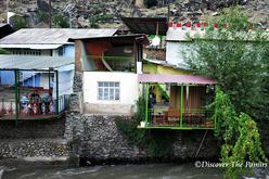 Guesthouse over a river in Darvaz